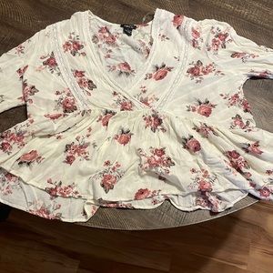 Colors are white red and some green with flowers